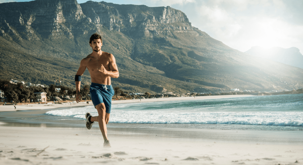 Getty images man running in right boards shorts for your body shape