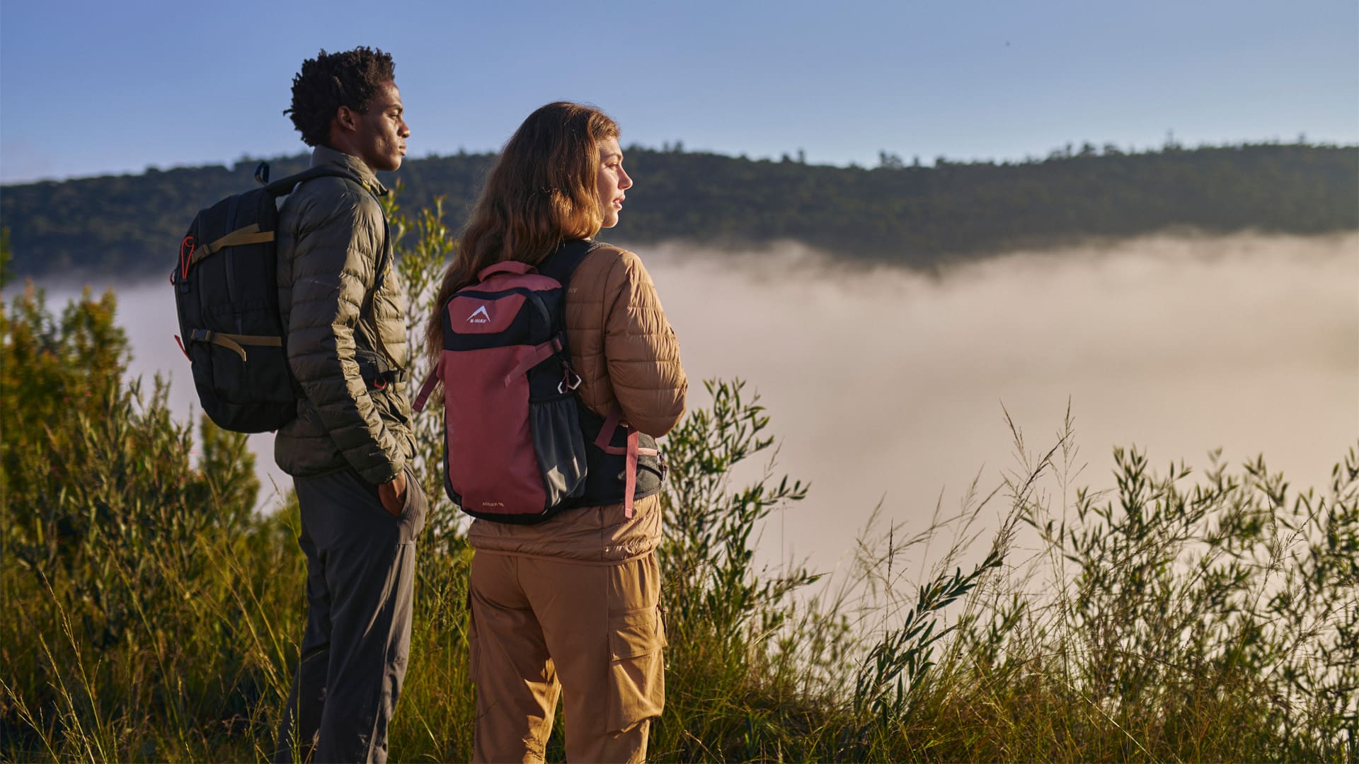 couple doing a hike and looking out at a view