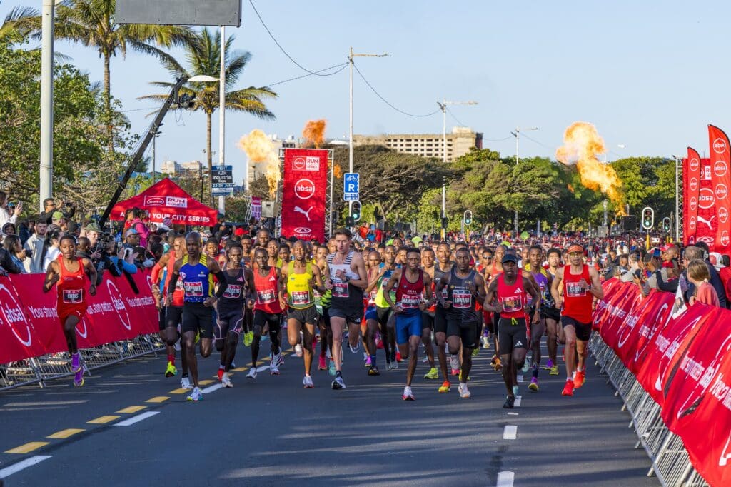 The elite men’s field in action at the 2025 Absa RUN YOUR CITY DURBAN 10K. PHOTO CREDIT: Anthony Grote
