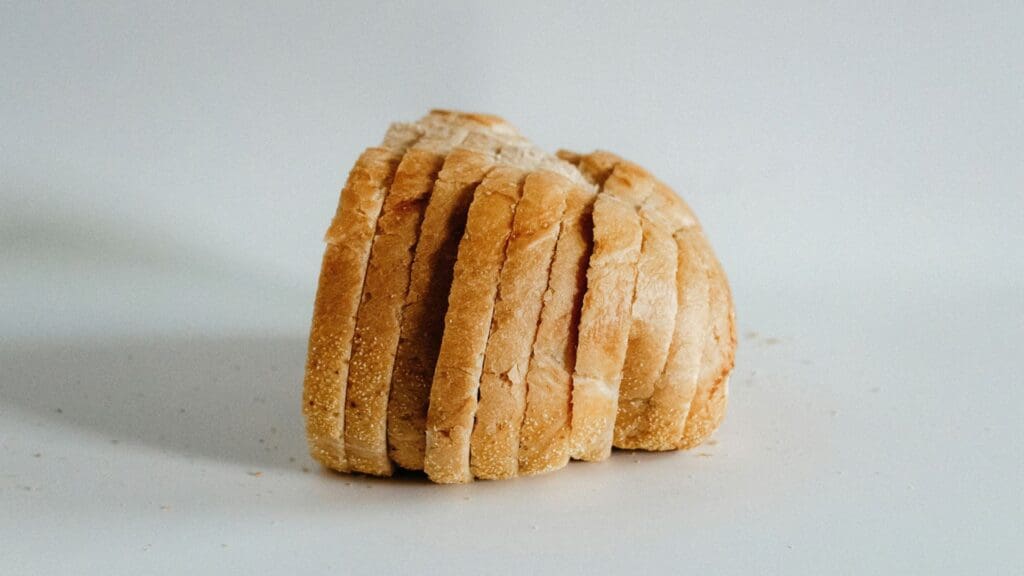 sliced bread sitting in front of white backdrop