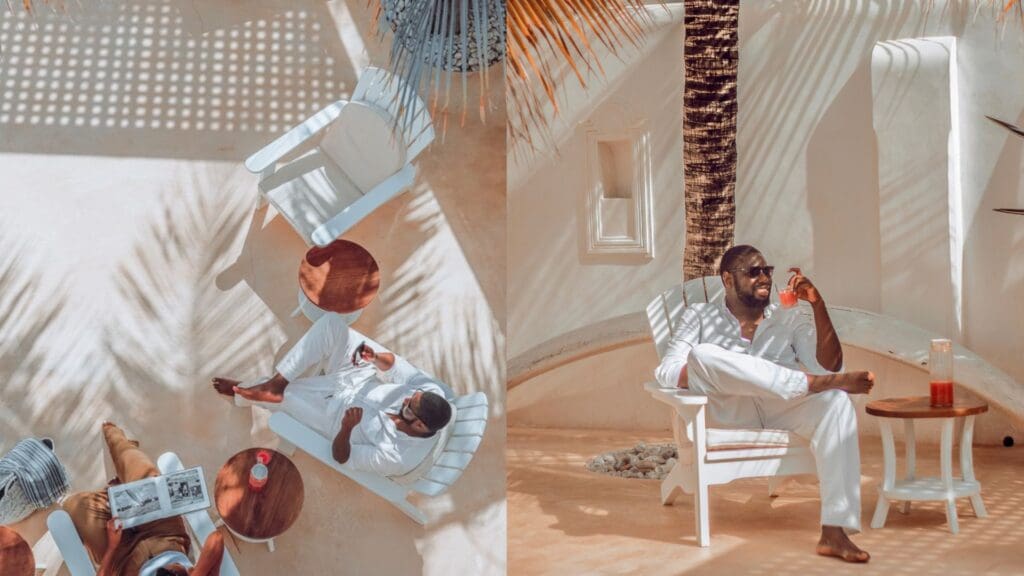 man sitting outside enjoying drink in lamu, kenya